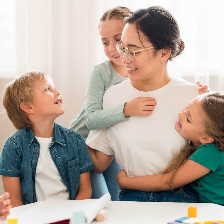 Kindergarten assistant with children