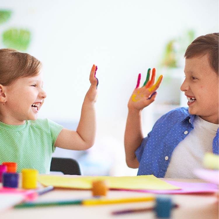 Two children doing arts and crafts together