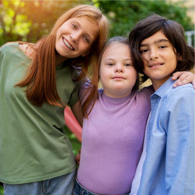 Three children together hugging