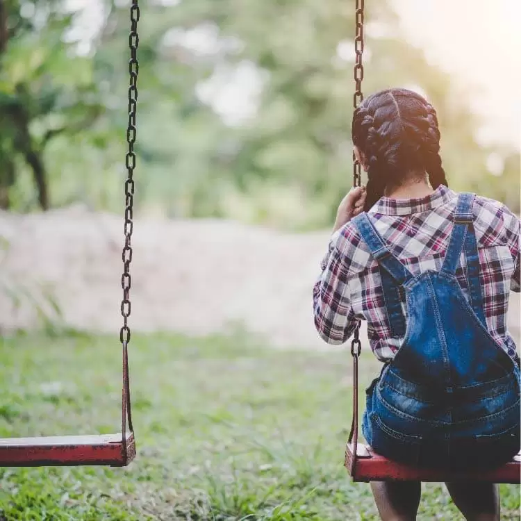 Girl alone on a swing
